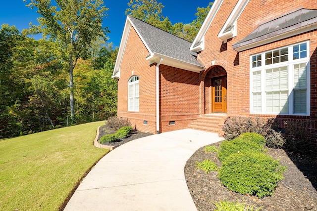 entrance to property with a yard