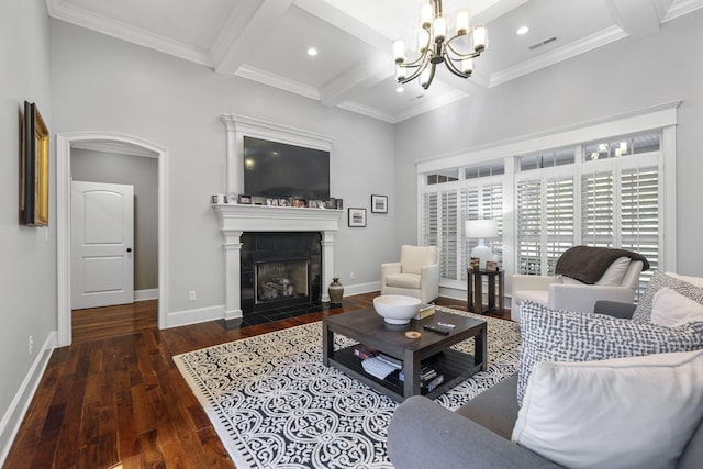 living room with coffered ceiling, crown molding, a fireplace, beamed ceiling, and dark hardwood / wood-style flooring