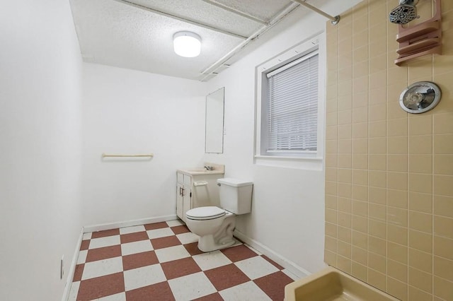 bathroom with vanity, toilet, and walk in shower