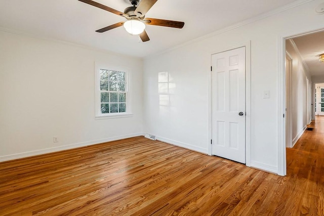 unfurnished bedroom with light hardwood / wood-style floors, ceiling fan, and ornamental molding