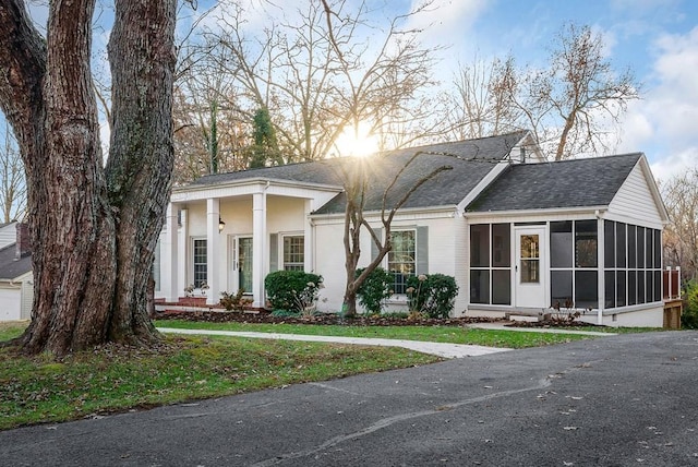 view of front of property with a sunroom