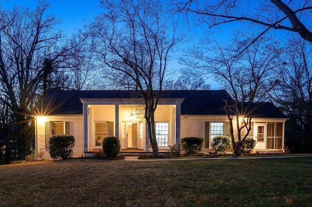 ranch-style house with a front lawn