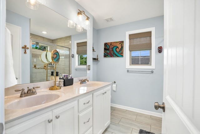 bathroom featuring vanity and an enclosed shower