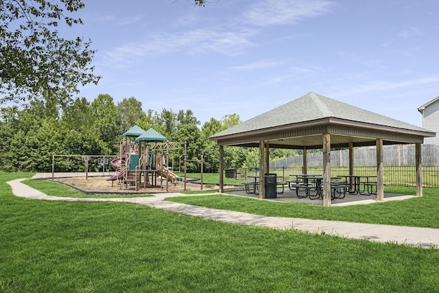 surrounding community featuring a gazebo, a playground, and a yard