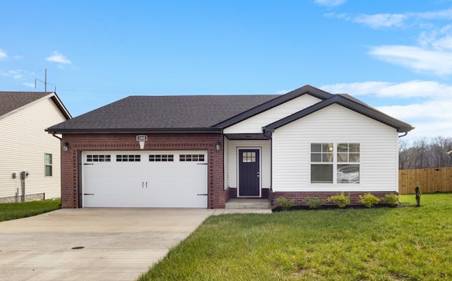 view of front facade with a front yard and a garage