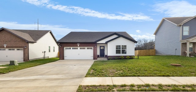 view of front facade with a front yard and a garage