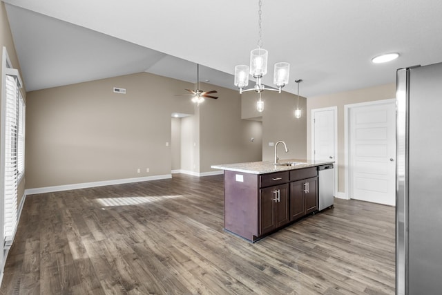 kitchen featuring sink, stainless steel appliances, an island with sink, pendant lighting, and dark brown cabinets