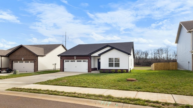 view of front of house with a garage and a front lawn