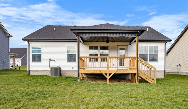 rear view of property with a lawn, ceiling fan, cooling unit, and a deck