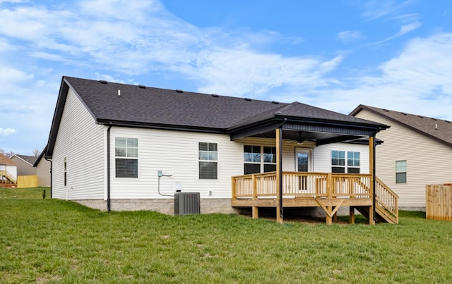 back of house with ceiling fan, cooling unit, a deck, and a yard