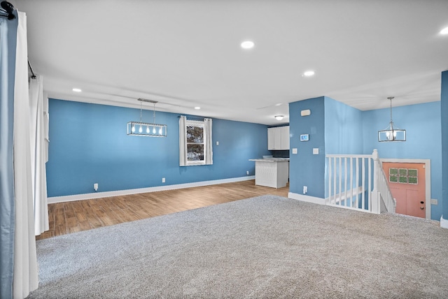 unfurnished living room with light hardwood / wood-style flooring