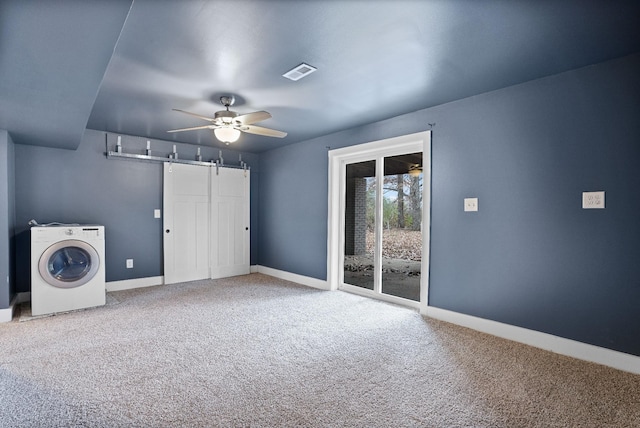 interior space featuring carpet flooring, ceiling fan, and washer / dryer