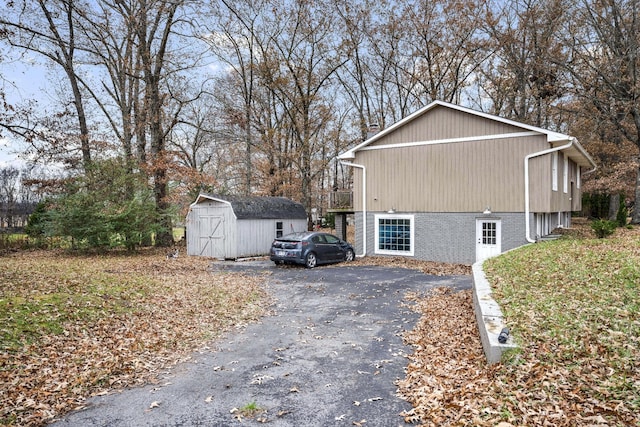 view of property exterior featuring a shed