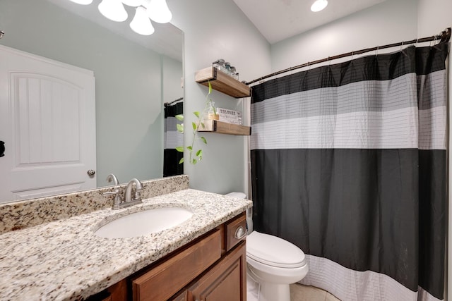 bathroom with a shower with shower curtain, vanity, and toilet