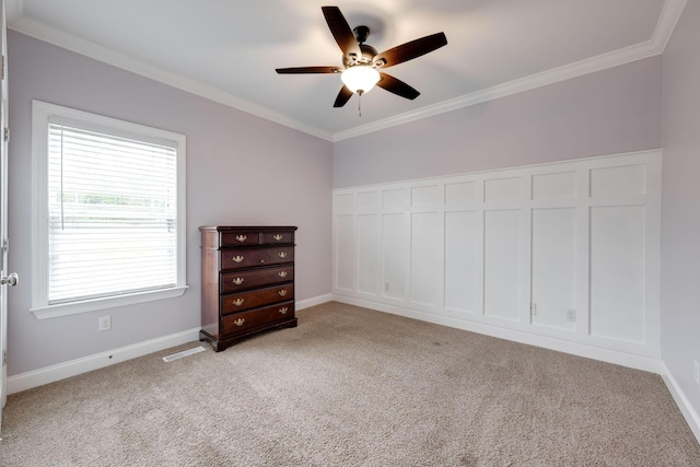 carpeted bedroom featuring ceiling fan, a closet, and ornamental molding