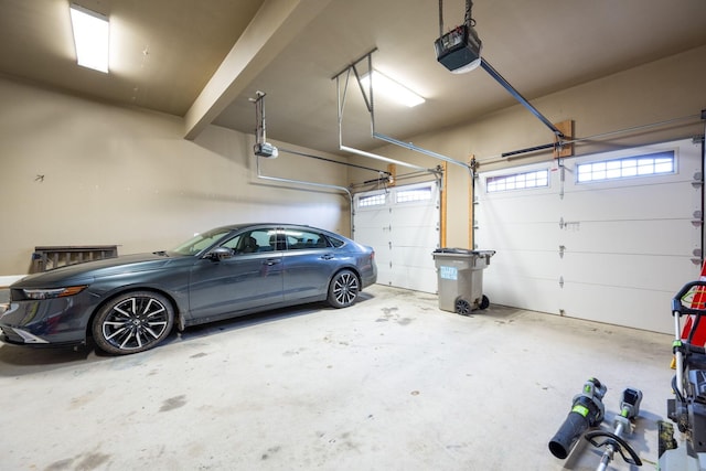 garage featuring a garage door opener