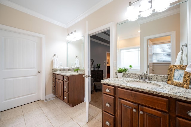 full bath with ornamental molding, tile patterned flooring, two vanities, a chandelier, and baseboards