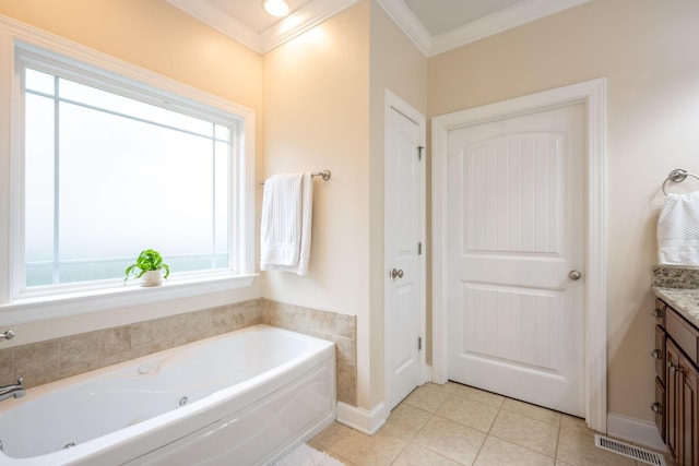 bathroom featuring vanity, a bath, tile patterned flooring, ornamental molding, and baseboards