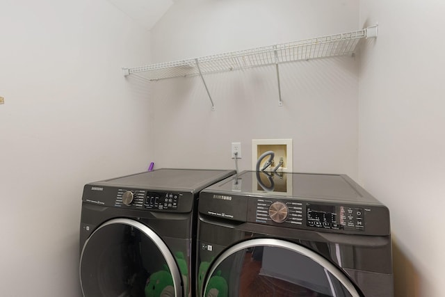 clothes washing area with washing machine and clothes dryer