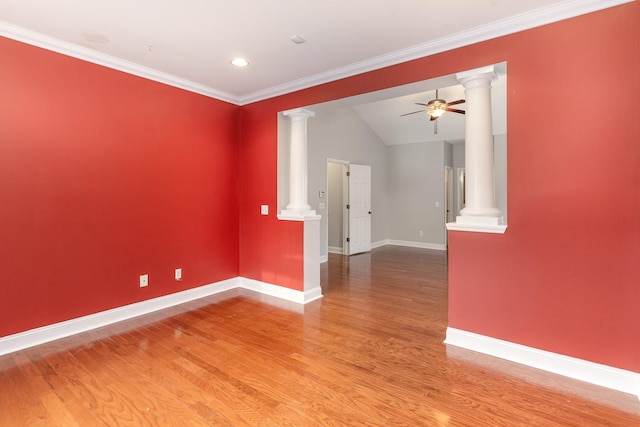 unfurnished room with ornate columns, ornamental molding, hardwood / wood-style floors, and ceiling fan