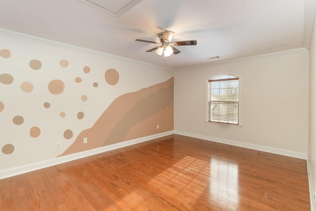 unfurnished room with hardwood / wood-style flooring, crown molding, and ceiling fan