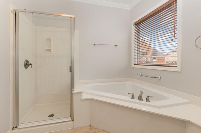 bathroom with crown molding, independent shower and bath, and tile patterned flooring