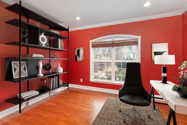 office space featuring wood-type flooring and ornamental molding