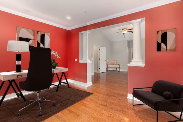 home office featuring crown molding, light hardwood / wood-style floors, ceiling fan, and ornate columns