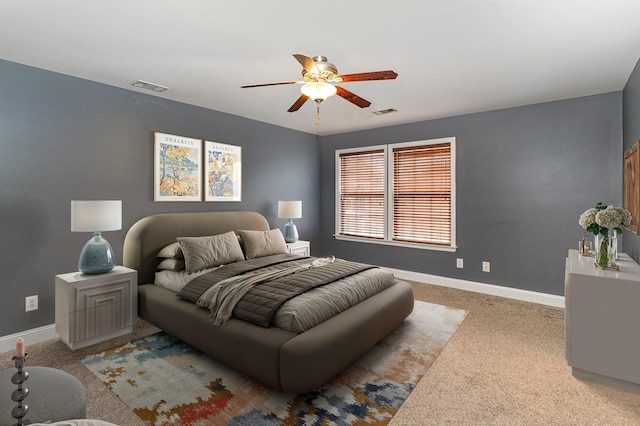 bedroom with light carpet and ceiling fan