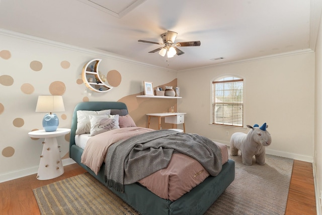 bedroom with ceiling fan, ornamental molding, and dark hardwood / wood-style floors