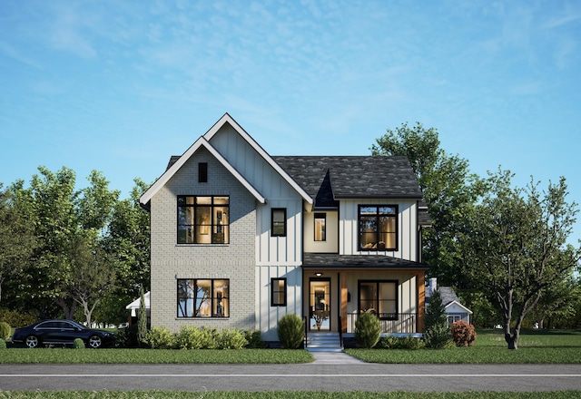 view of front of house with a porch and a front yard