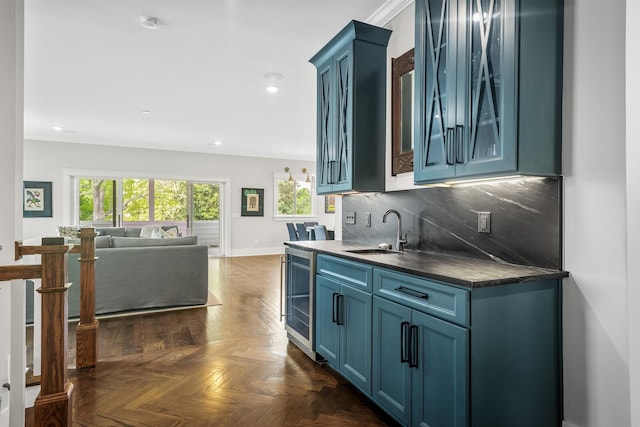 kitchen featuring blue cabinetry, sink, wine cooler, dark parquet floors, and decorative backsplash