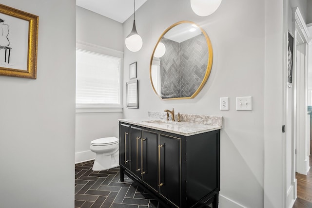 bathroom with vanity and toilet