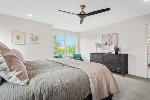 bedroom featuring light colored carpet and ceiling fan