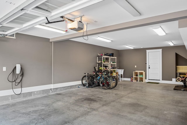 garage featuring sink and a garage door opener