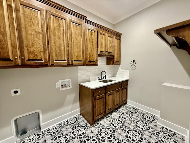 clothes washing area with sink, cabinets, hookup for an electric dryer, hookup for a washing machine, and light tile patterned floors