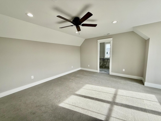 bonus room with ceiling fan, carpet, and vaulted ceiling