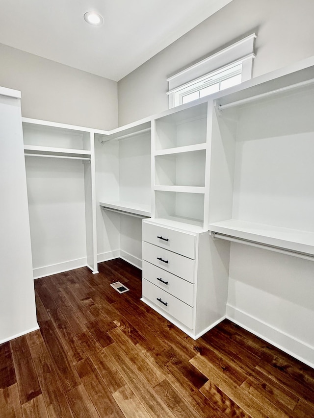 walk in closet featuring dark wood-type flooring