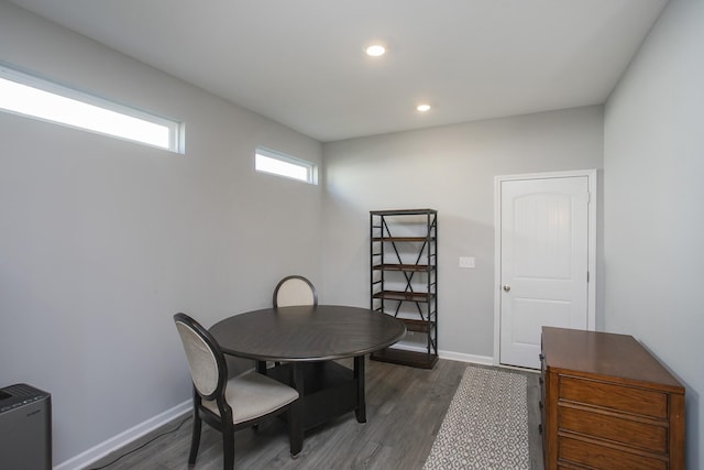 dining space with dark wood-type flooring