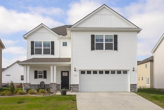 view of front of property with a garage and a front yard