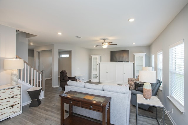 living room with ceiling fan and hardwood / wood-style flooring