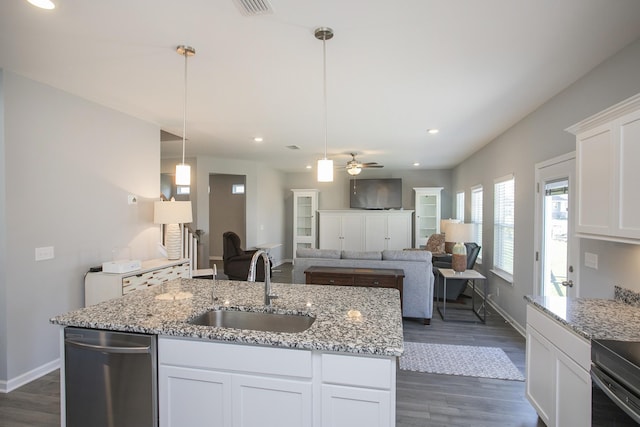 kitchen featuring dark wood-type flooring, sink, ceiling fan, decorative light fixtures, and white cabinetry