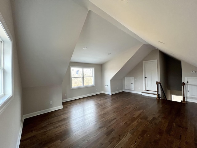 bonus room featuring dark hardwood / wood-style floors and lofted ceiling