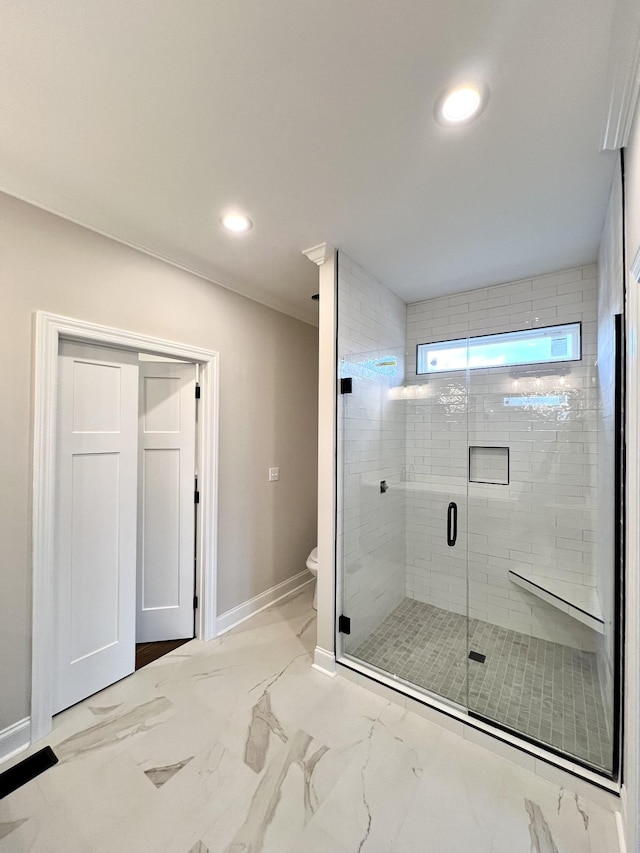 bathroom with toilet and walk in shower