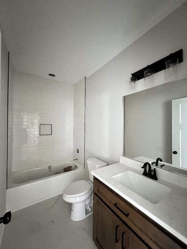 full bathroom with vanity, toilet, and tiled shower / bath