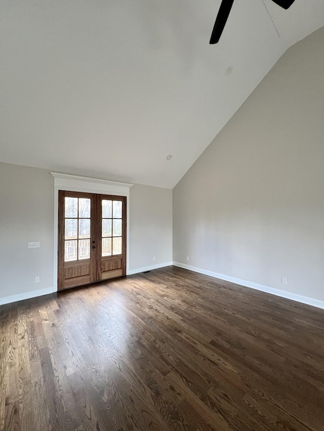 unfurnished room with dark hardwood / wood-style floors, ceiling fan, lofted ceiling, and french doors