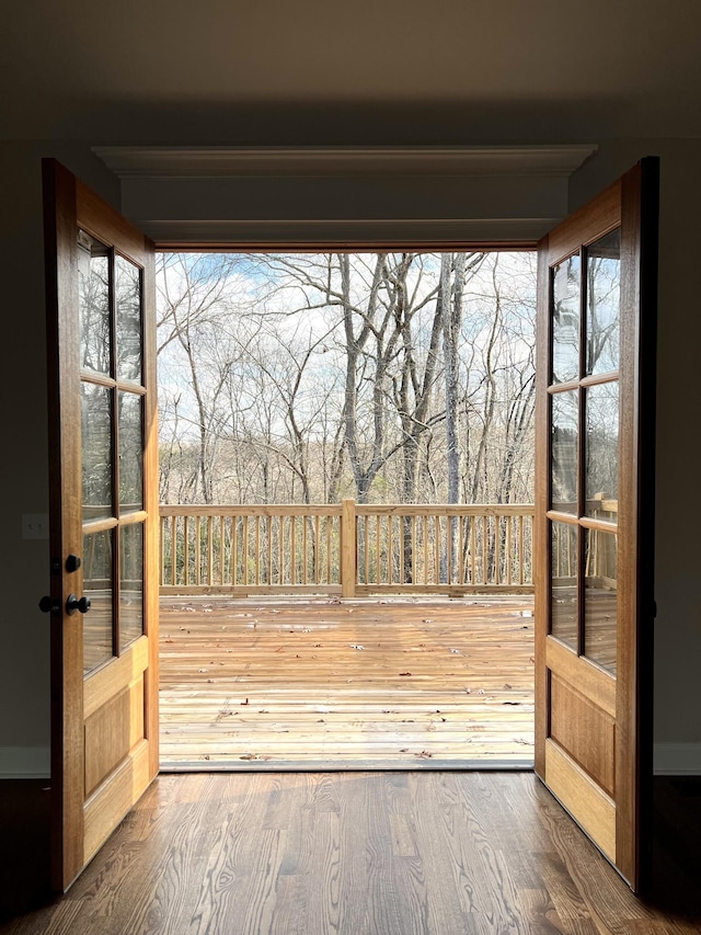 entryway with french doors and hardwood / wood-style flooring