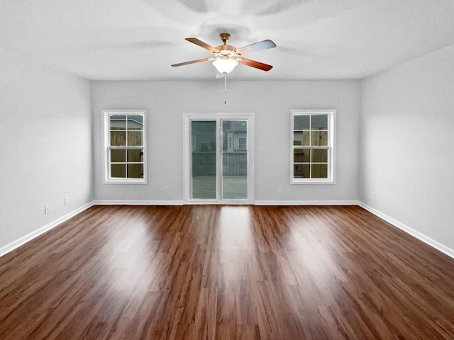 spare room featuring ceiling fan and dark hardwood / wood-style flooring