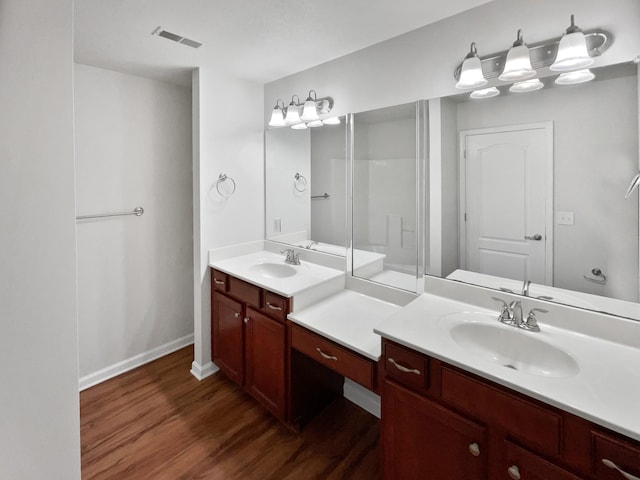 bathroom with vanity and hardwood / wood-style flooring