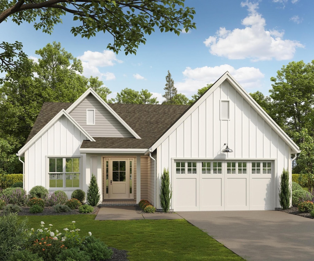 modern farmhouse with a garage and a front lawn